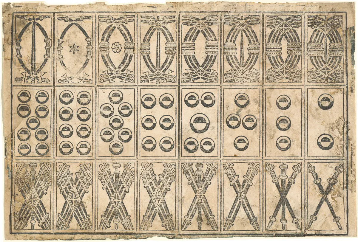 A printed sheet of early Italian playing cards with cups, coins, swords, and clubs.