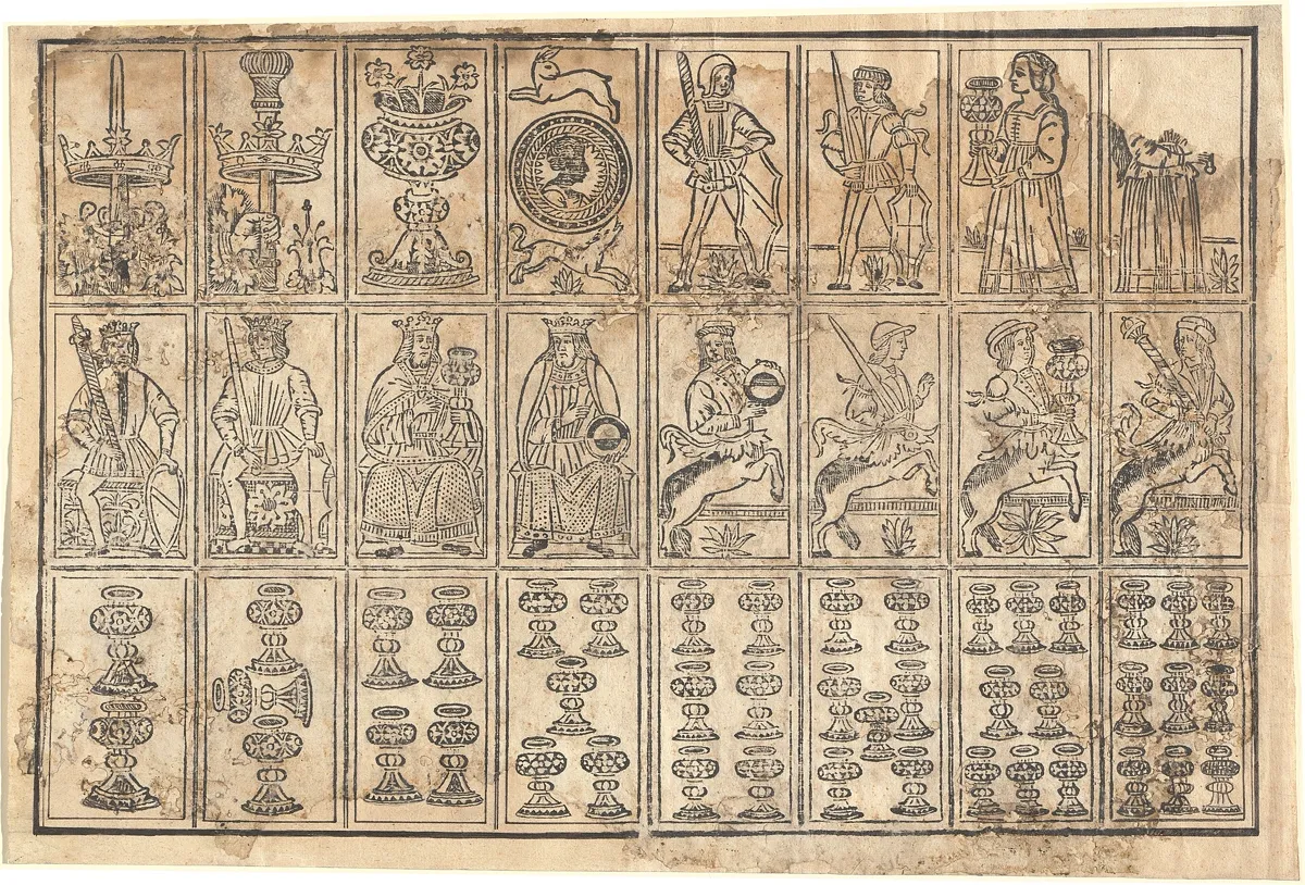 A closer uncut Italian sheet showing sword, club, cup, and coin aces, then a row of cup number cards.